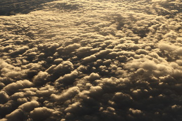 Sunset White Cloud sky at high level attitude, view from window airplane