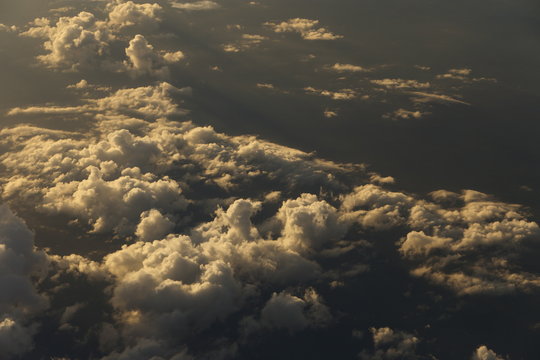 Sunset White Cloud sky at high level attitude, view from window airplane © Jade