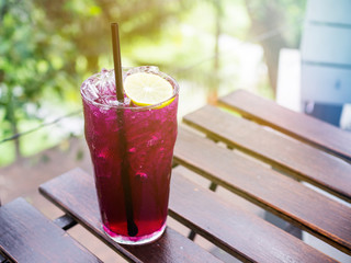 Vintage filtered on butterfly pea flower juice with sliced lemon decoration