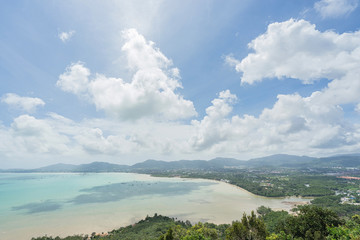 Fototapeta na wymiar Sea, sky and seaside town of Ao Chalong bay from Khao-Khad mountain viewpoint. Famous attractions in Phuket island, Thailand