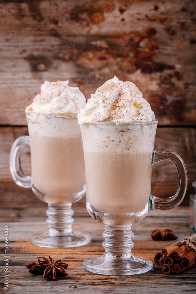Wall mural Pumpkin spice latte with whipped cream and cinnamon - Wall murals