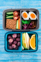 lunch box with healthy food. Carrots, eggs, vegetables, fruits.
