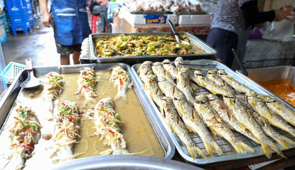 Fried salted fish and various Thai style food for sell at Nang Loeng market, Bangkok, Thailand