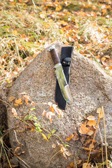 knife hunting on a large rock in the autumn afternoon