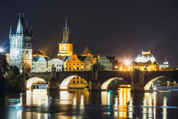 Fototapeta premium View of Charles Bridge and Vltava river at night in Prague, Czech Republic