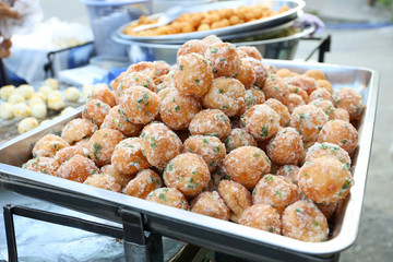 Local seller make Thai fried sweet doughnut ball,  Khanom Khai Hong, Bangkok, Thailand