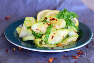 Salad with fresh zucchini , basil, lemon, garlic and olive oil.