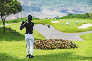  lady golf swing on golf course