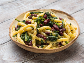 Italian artisanal fresh pasta with kidney beans and broccoli