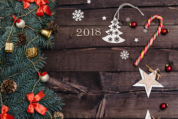 Sigh symbol from number 2018 on vintage style wooden texture background. Happy New Year 2018 greetings on wooden. Empty space for your text. Christmas background with decorations, xmas tree and gift