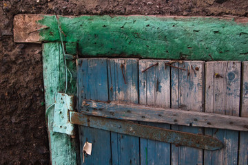 old wooden door in rusty nails. detail