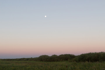 The moon over the steppe. before sunrise