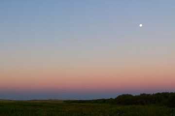The moon over the steppe. before sunrise