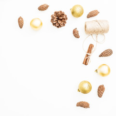 Christmas or New Year frame made of Christmas decoration and pine cones on white background. Flat lay, top view