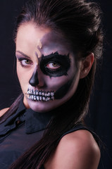 Beautiful woman with make-up skeleton