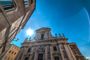 Fototapeta na wymiar Sun shining over San Giovanni de fiorentini church