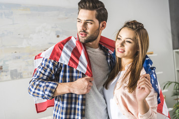 couple wrapped in American flag