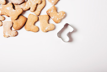 Gingerbread and cookie cutters background.Christmas shoe.Top view.Flat lay.