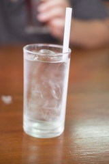 Glass of clean water with ice