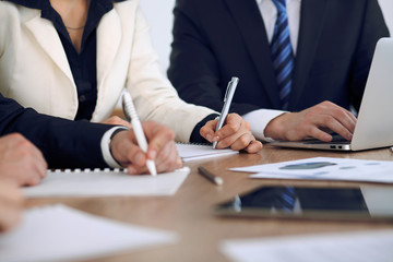 Group of business people or lawyers  at meeting, hands close-up
