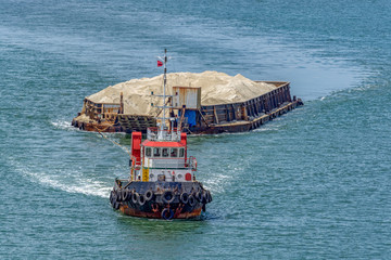 Tug boat with a barge