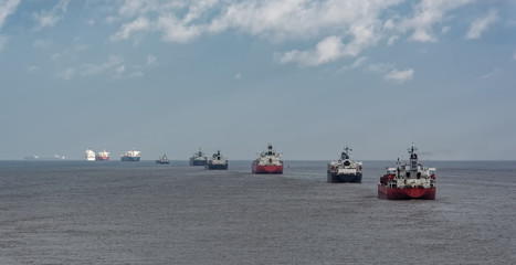 Various ships queue offshore approaching Shanghai.