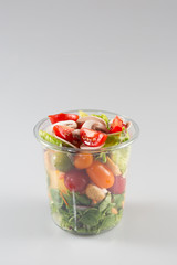 servings of prepared salad in plastic takeaway containers