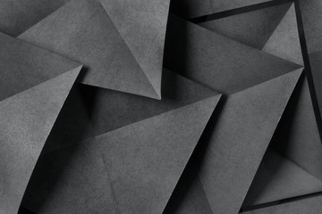 Geometric shapes of paper, grey background