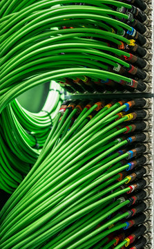 Many green network wires connected to the server
