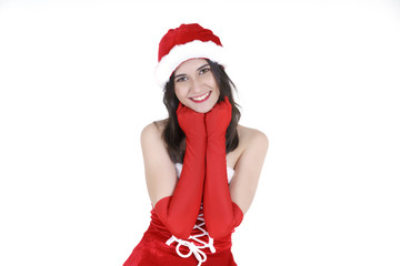 Christmas concept : Beautiful smiling young Asian woman in Santa Claus costume , hands under her chin isolated on white background