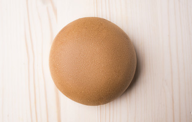 Hamburger bun on a wooden background
