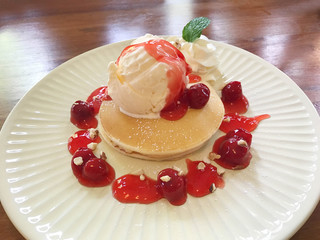 Pancake with vanilla ice cream and cherry sauce