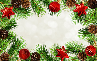 Fototapeta na wymiar Christmas tree twigs, cones, balls and bokeh