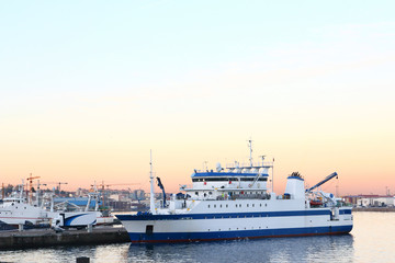 fishery research vessel in the port at sunrise