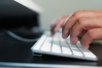 Hand typing computer keyboard