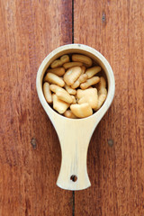 English alphabet made from biscuit in wooden dipper.