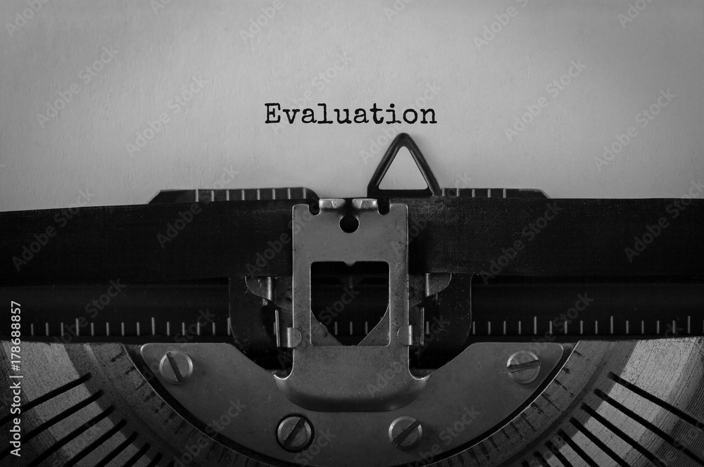Fototapete text evaluation typed on retro typewriter