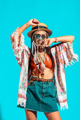 bohemian girl holding dreamcatcher