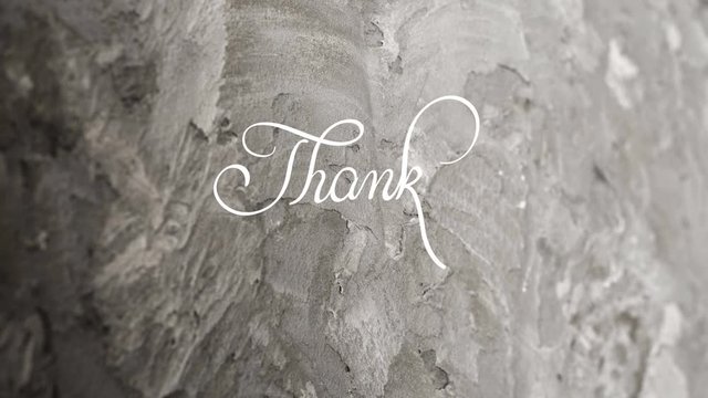 Written animation Thank you calligraphy lettering text with Ornate frame elements on gray dirty grunge background. Vintage and filigree decoration. Filigree divider animation words