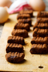 Chocolate gnocci on wooden board.style rustic.