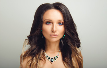 Studio Portrait of Beautiful Model with Long Curly Ombre Hair. Shiny Wavy Hair. Close up
