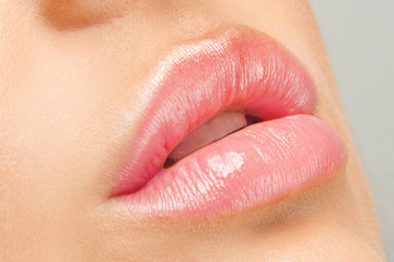 Close-up of Woman's Lips with Bright Fashion Pink Lips. Macro Lilac Lipstick Make-up