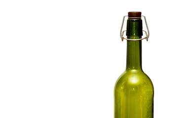 green glass bottle with a stopper
