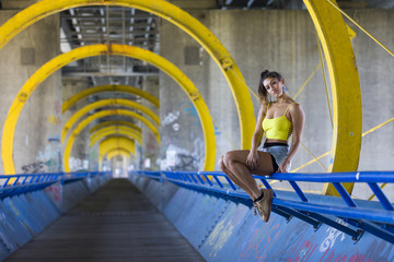 Attractive woman wearing yellow belly top