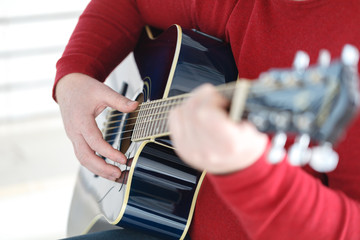 hand playing folk guitar action design