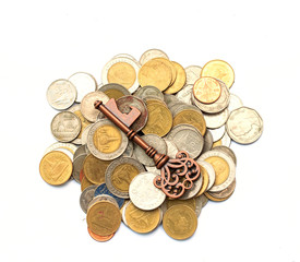 Business success concept - key and money coins