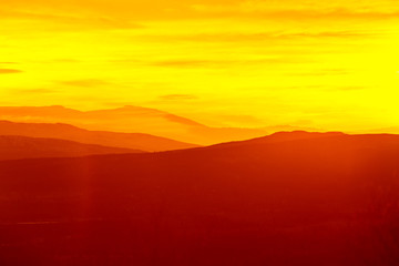 Beautiful, colorful autumn sunrise over the mountains in Norway. Abstract, colorful look.