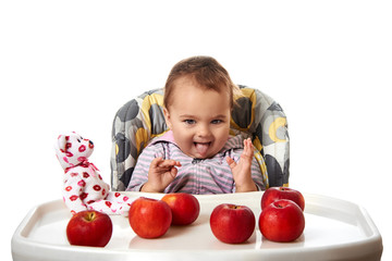 Cute child with red apples isolated on white background