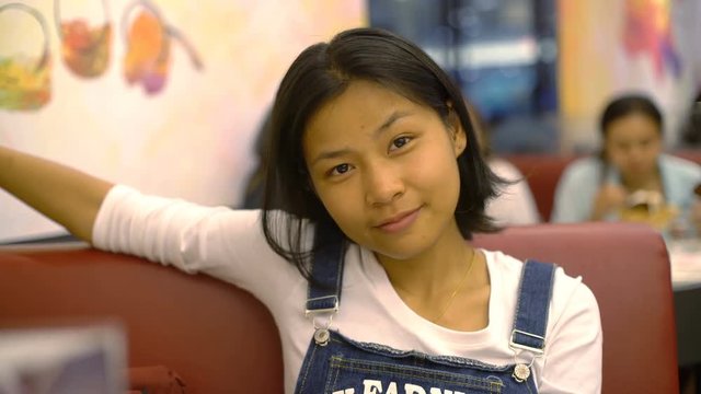 Young Asian Woman waiting for her order at cafe 4k UHD (3840x2160)
