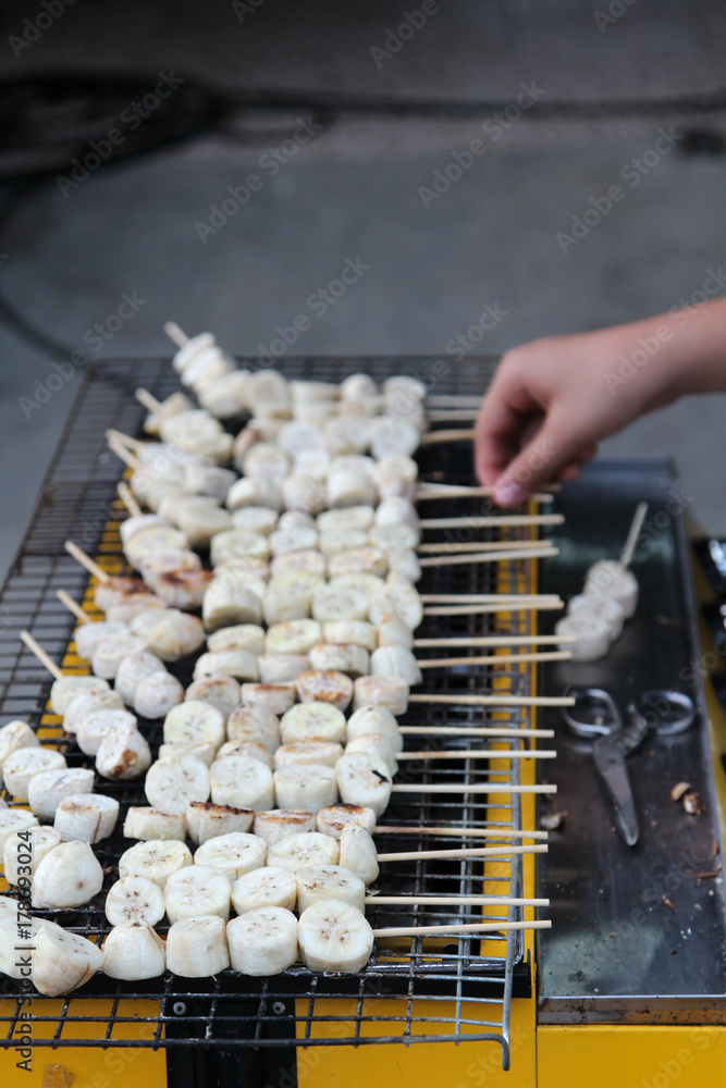 Wall mural thai dessert, thai dessert sweet grilled banana on stove